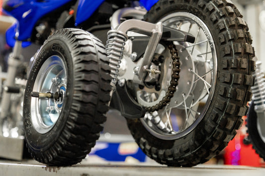 MINI MOTO REAR MOUNTED TRAINING WHEELS YAMAHA TTR 50, HONDA CRF 50 & SUZUKI DRZ 50 - SILVER